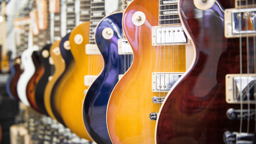 Les Paul guitars on a rack in a store