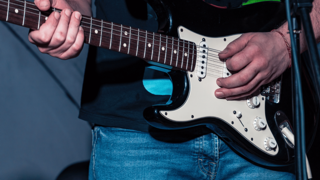 Left handed electric guitar player