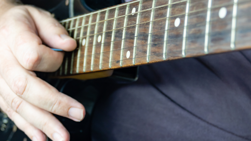 Are Guitars Harder Than Pianos - guitar player