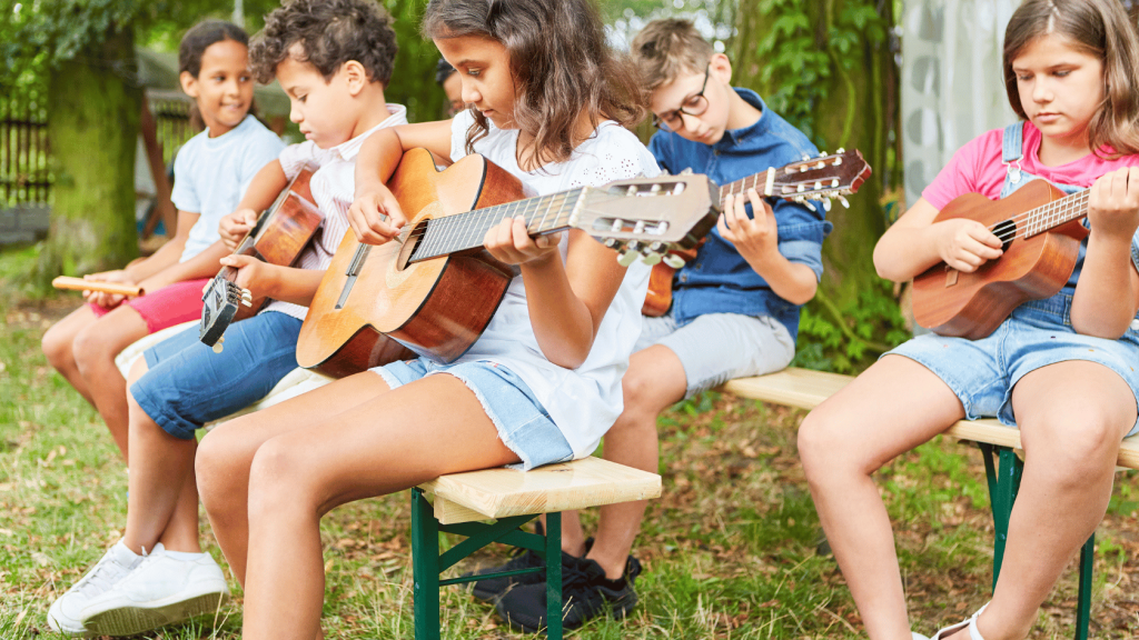 Children learning guitar