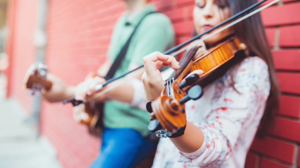 What is harder violin or guitar players