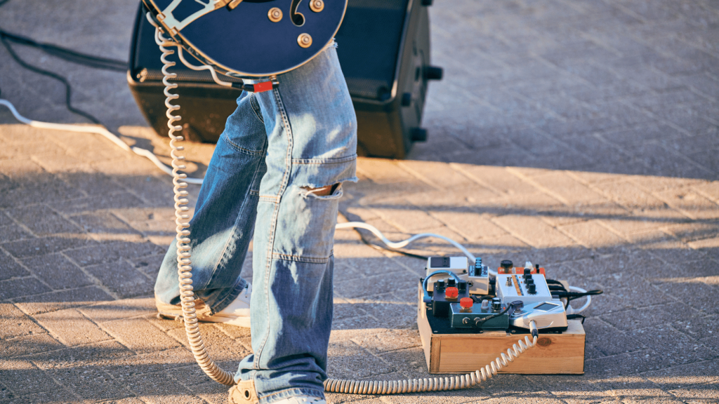 Guitar player with pedal board