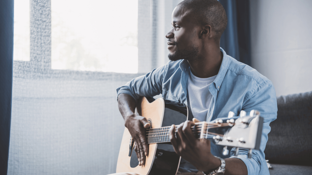 Guitar player with acoustic guitar
