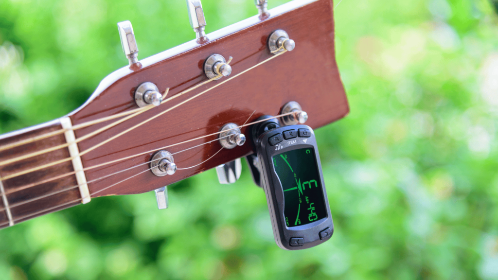 Guitar with clip on tuner
