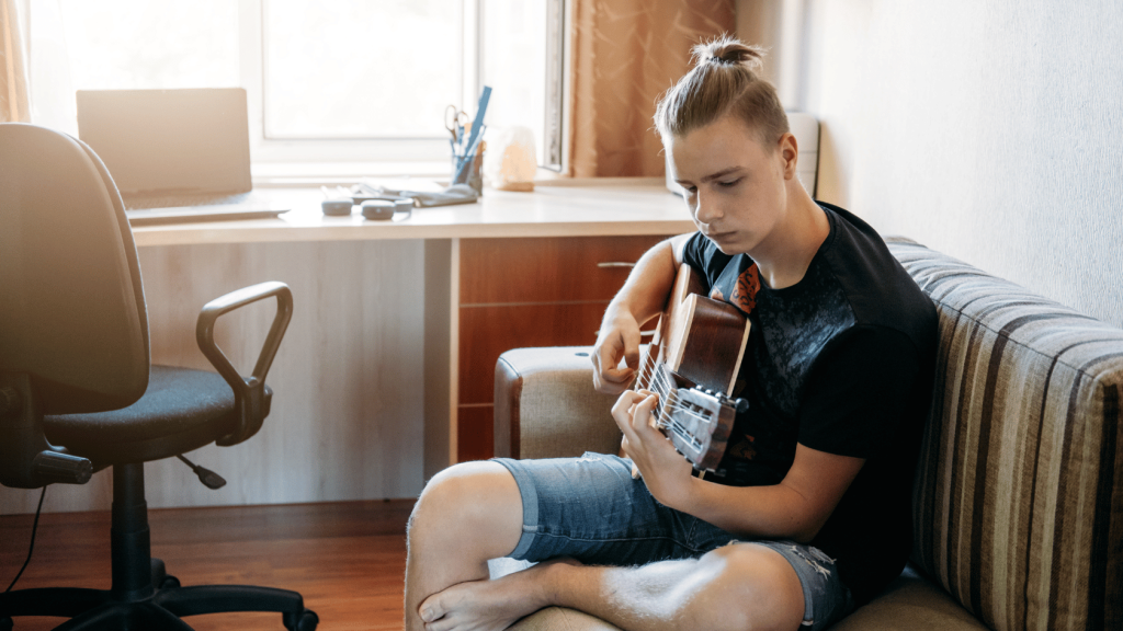 Guitar player learning to play