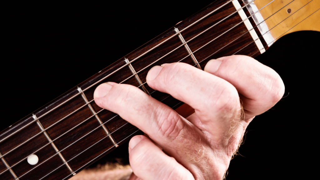 Guitar Player playing the C Major chord
