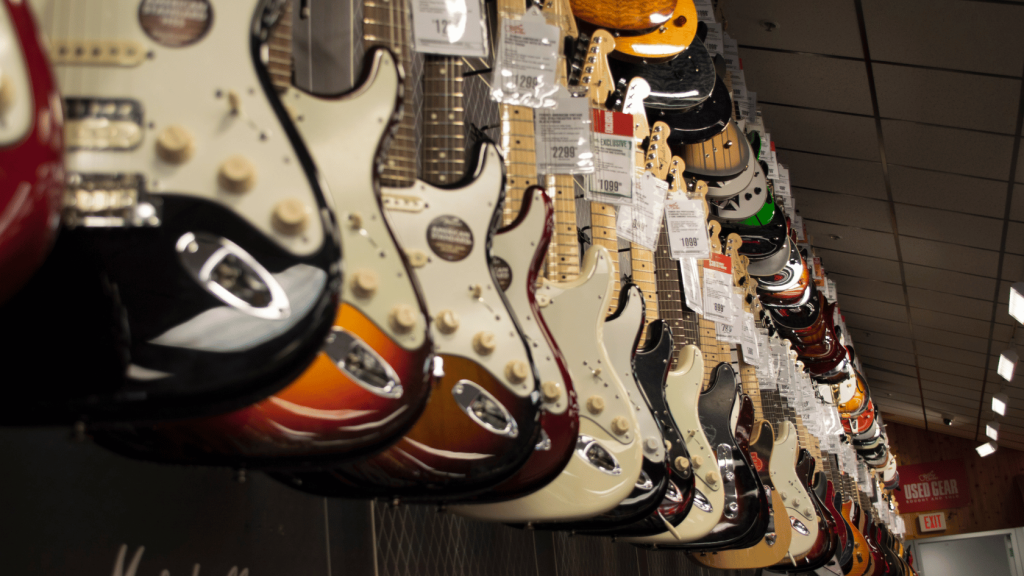 Guitars in a rack in a retail store