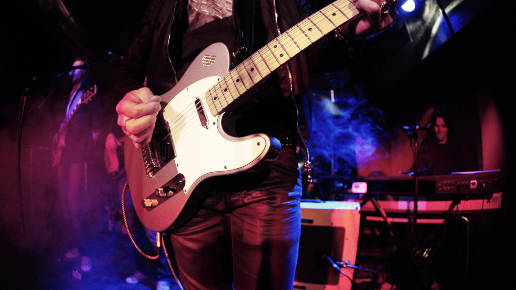 Guitar player with a band