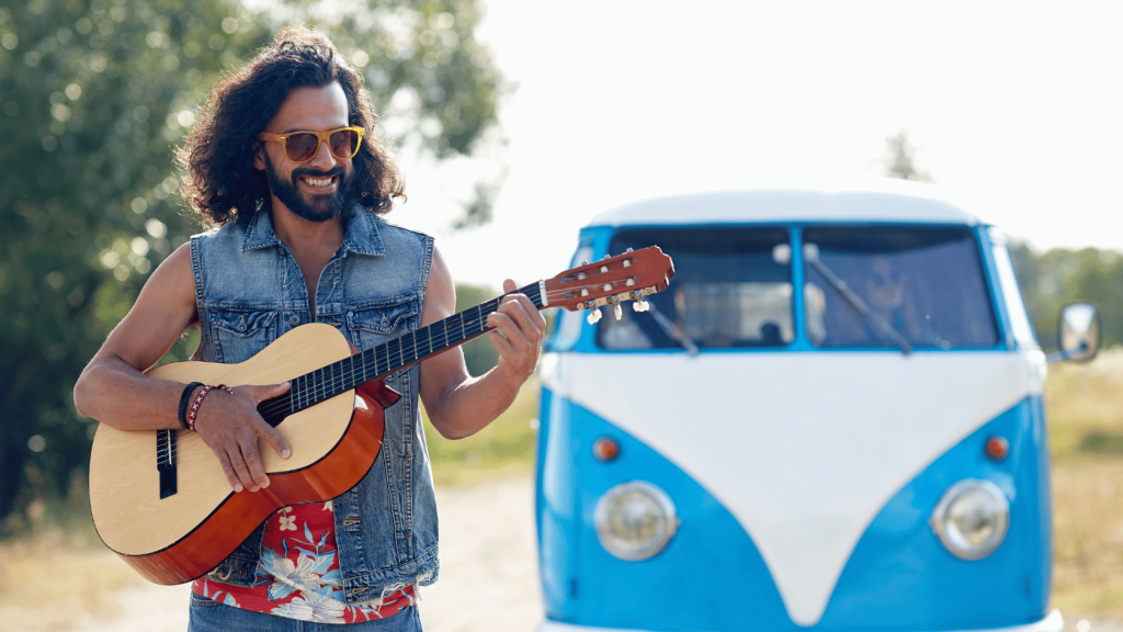 Acoustic guitar player and a VW bus
